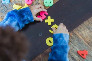 child playing with letters